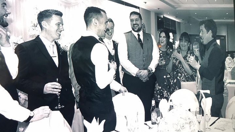 John performing at a wedding reception